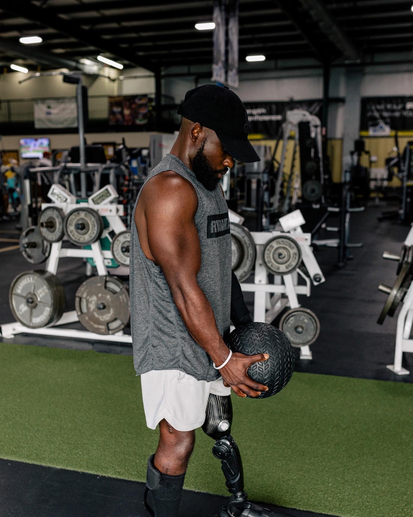 Myles training in the gym with a prosthetic leg