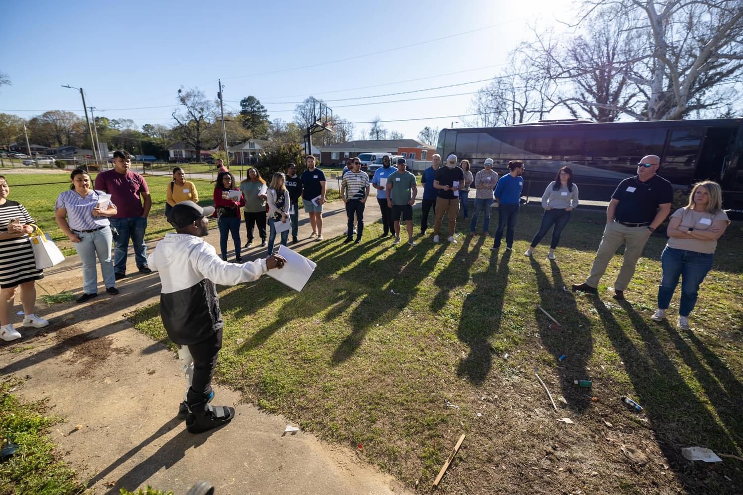 Myles teaching a group of students out on the land